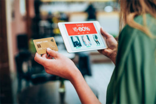 Woman shopping on tablet